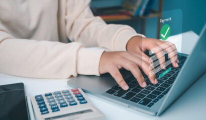 Accounts payable automation software for Singapore SMEs with digital payment processing on a laptop.