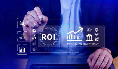 Business professional using digital technology to analyse ROI and business growth for Singapore SMEs.
