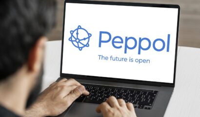 Peppol logo displayed on a laptop screen for Singapore e-invoicing and Peppol access point services.